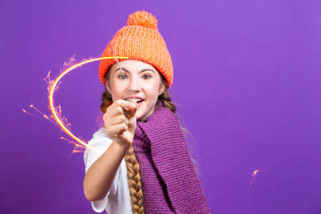 Winsome Caucasian Female Guitar Player With Yellow Bass Guitar Posing In Fashionable Yellow Hoody...