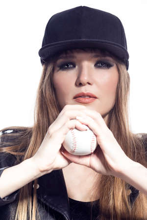 Portrait of Winsome Caucasian Female Athlete Sportwoman in Fitness Skinny Outfit Wearing Colorful Windstopper Jacket While Posing With Lifted Leg On White.Vertical Orientation Imageの写真素材