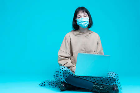 Sadly Looking Caucasian Brunette Female Girl With Vivid Contrasty Makeup Posing in Street Clothing Style and Jewelry in Studio Against White. Vertical Shotの写真素材