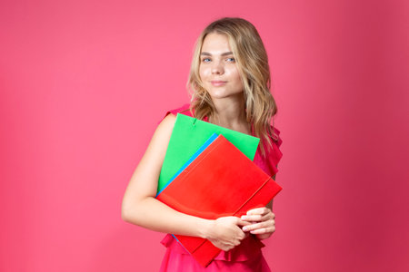 Surprised Winsome Caucasian Female Girl Showing Excitement While Wearing Straw Hat Posing  Over Coral Pink Background. Vertical Image Compositionの写真素材