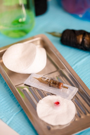 Variety of Working Accessories and Tools for Tattoo Cosmetology Beautician Ready For Permanent Makeup Procedure In Beauty Salon. Vertical Image Compositionの写真素材