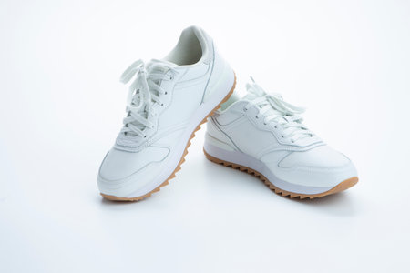 Pair of New Professional White Sneakers Over White Background. Horizontal imageの写真素材
