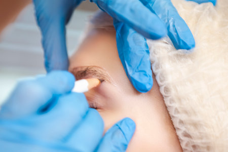 Smiling One Winsome Female Road Cyclist Posing With Modern Carbon Race Bike In Short Sleeve Cycling Outfit Against Yellow Background. Vertical Compositionの写真素材