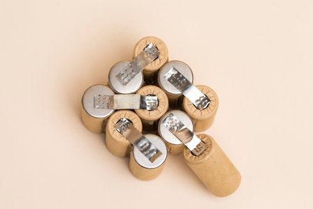 Energy and Environment Ideas. Upper View of Bundle of Soldered Ni-Mh Rechargeable Batteries  Placed Together Over Beige.Horizontal imageの写真素材