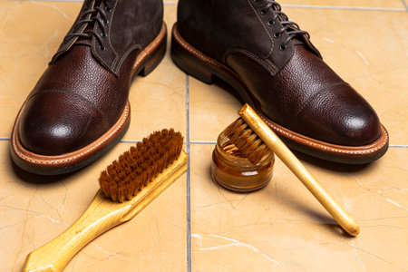 Upper View of Various Shoes Cleaning Accessories for Dark Brown Grain Brogue Derby Boots Made of Calf Leather with Special Tools. Horizontal Compositionの写真素材