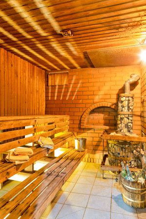 Bath House Ideas. Interior of Small Finnish Russian Wooden Banya Or Sauna With Sauna Acessories.Vertical Image Compositionの写真素材