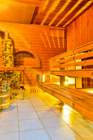 Interior of Small Finnish Russian Wooden Banya Or Sauna With Sauna Acessories.Vertical Imageの写真素材