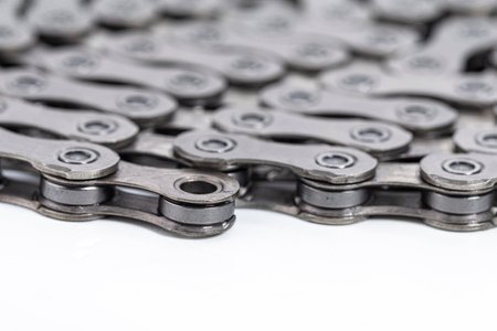 New Clean Oiled Twisted Circled Bicycle Chain Image Texture Isolated Over White Background....