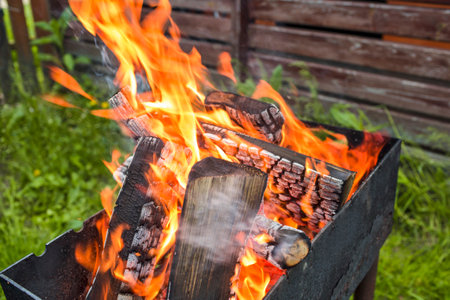 Closeup of Fire at Open Fireplace Outdoors with Balls of Flame. Horizontal Imageの写真素材