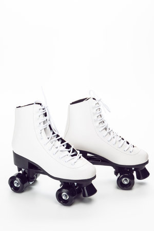 Sport Ideas. Pair of White Stylish Roller Skates on White Background. Vertical imageの写真素材