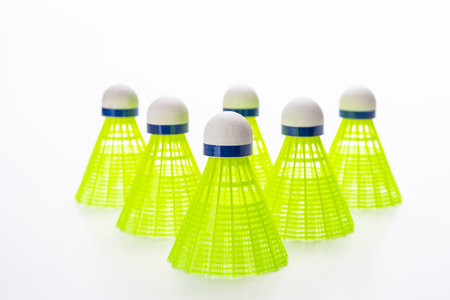 Upper Top View of Shuttlecocks Set Arranged on White Background As Flatlay with Copy Space.Horizontal imageの写真素材
