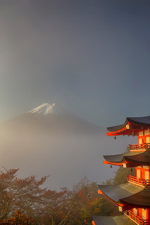 View of Kiyomizu-dera Temple Pagoda Against Kyoto Skyline  and Traditional Red Maple Trees in Japan. Vertical imageの写真素材