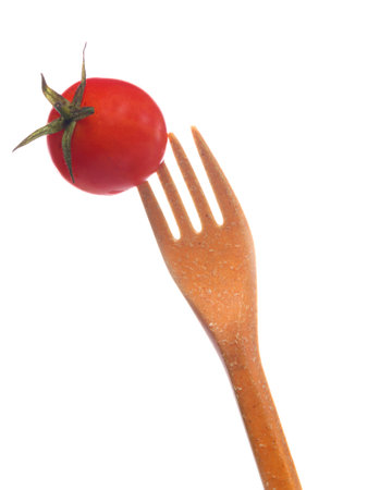 One Small Fresh Juicy Red Tomato Placed Pirced On Plastic Disposable Fork Isolated on White Background. Square Imageの写真素材