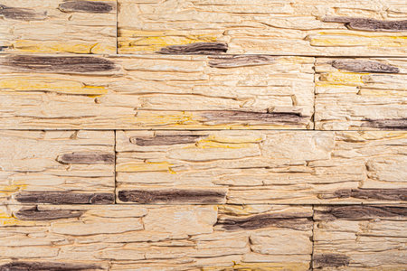 Decoration Facing of Yellow Pale Long Wall Pavement Stone Sample Tiles Indoors. Horizontal Image