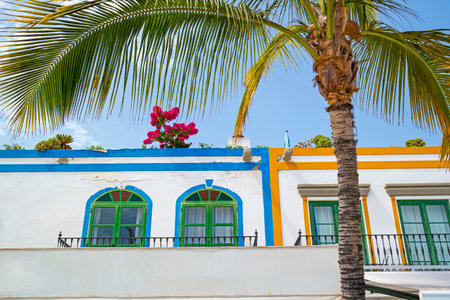 Traditional White Wall Buildings And Balconies with Bunch of Flowers in Puerto de Mogan at Gran Canaria island in Spain.Horizontal imageの写真素材