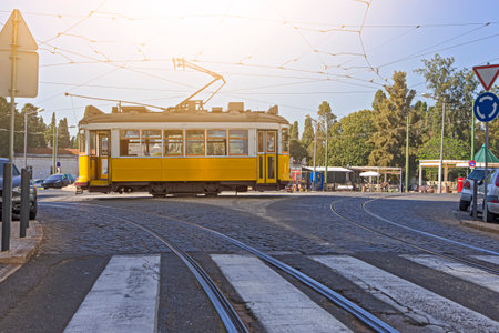 Outdated Retro Vintage Yellow Ancient Tram Tramway on Streets of Lisbon in Portugal. Horizontal Imageの写真素材