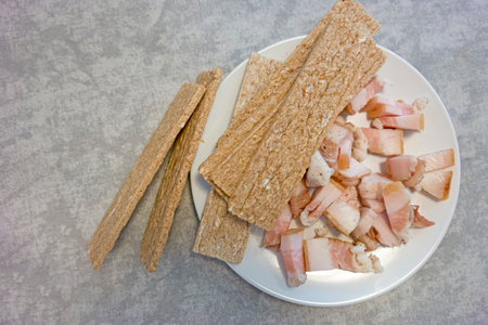 Traditional Sliced Ukrainian Salo Served With Dried Slices of Bread Top view Against Rustic Wooden Table Background.Horizontal Imageの写真素材