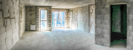 Architecture Concepts. Interior View of Newly Built Apartment With No Decoration in Bright White Colors With Rough Finish. Horizontal Compositionの写真素材