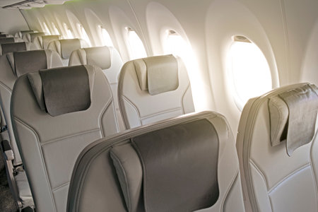 Row of Aircraft Cabin Cockpit Seats in Plane During Flight As Idea of Travel And Tourism on...