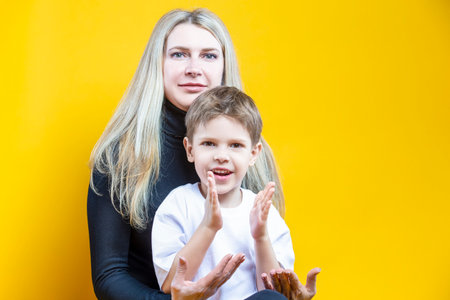 Cheerful Happy Couple Woman And Child Boy In Casual Clothing Having Mommy Little Kid Son Hug Cuddle...