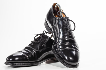 Closeup Image of Pair of Stylish Classic Formal Male Black Polished Oxford Leather Laced Shoes Placed Together Over White. Horizontal Image Compositionの写真素材