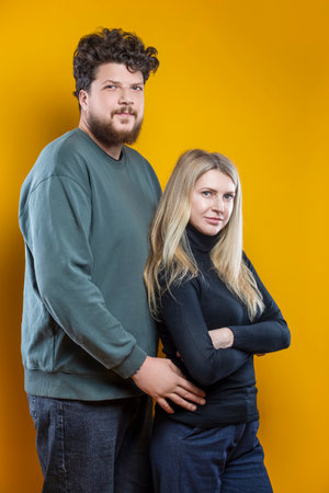 Portrait of Young Positive Caucasian Smiling Happy Adorable Couple As Man And Woman Casual Clothing...