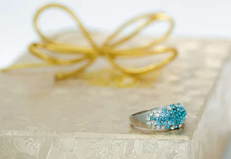 Silver ring on a gift boxの写真素材