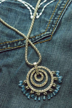 Jewelery on a jeansの写真素材