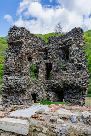Medieval broken tower. The custom-house on Olt river in Carpathian mountains.の写真素材