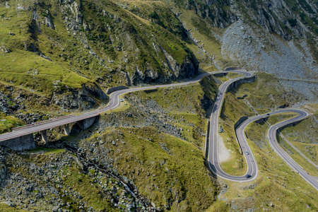 Winding mountain road with dangerous curves in Carpathian mountains. Transfagarasan road in Romania.の写真素材