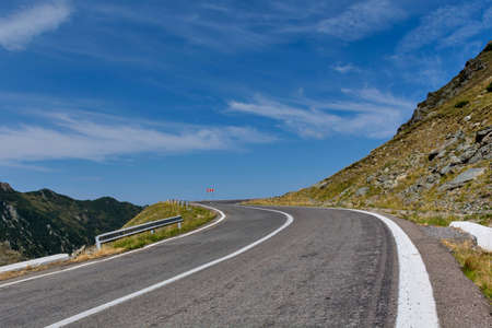 Winding mountain road with dangerous curves in Carpathian mountains. Transfagarasan road in Romania.