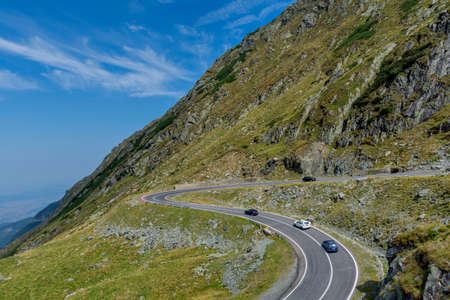 Mountain landscape with road and moving cars. Transfagarasan mountain road view.の写真素材