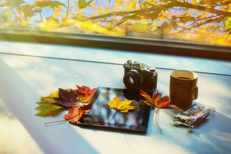 Enjoy morning with coffee and iPad by window in the wintertimeの素材