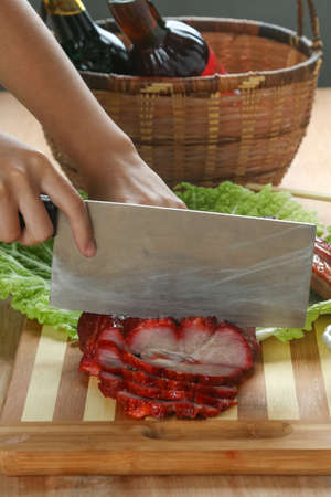Cantonese cuisine Char siu  literally "fork-roast" on a cutting boardの写真素材