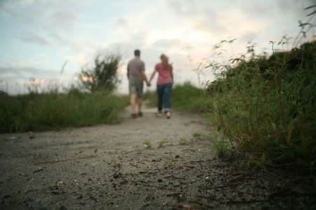 Couple walking a pathの写真素材