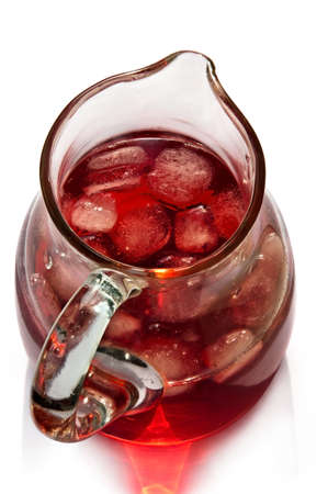  	A glass jug with red drink and pieces of ice, view from aboveの写真素材