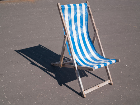 blackpool vintage wooden deck chair blue and white seasideの写真素材