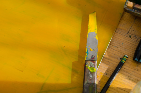 yellow acrylic paint preparing for mono print and screen printingの写真素材