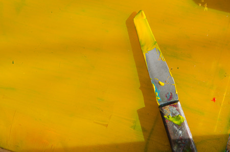 yellow acrylic paint preparing for mono print and screen printing