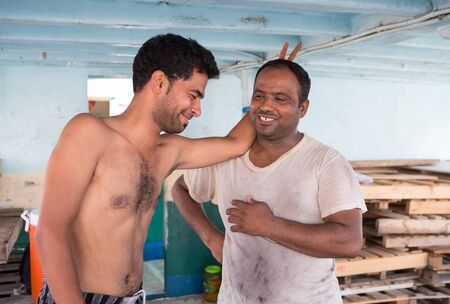 Syrian cargo ship workers taking a break and sharing a jokeのeditorial素材