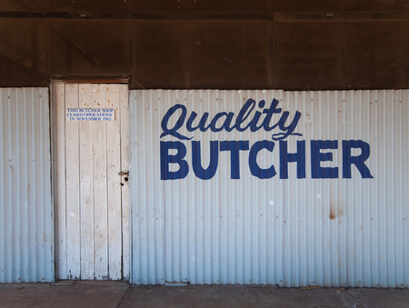 Western Australia, Australia, Old abandoned hand painted butchers shop sign in a small outback townの写真素材