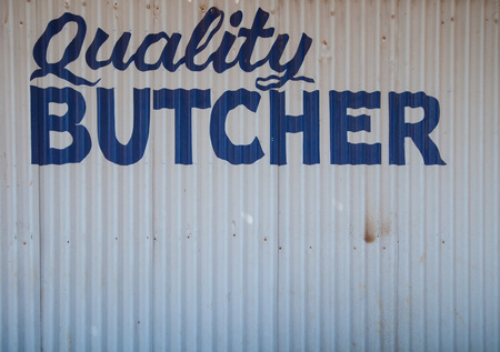 Western Australia, Australia, 08/08/2015, Old abandoned hand painted butchers shop sign in a small outback townのeditorial素材