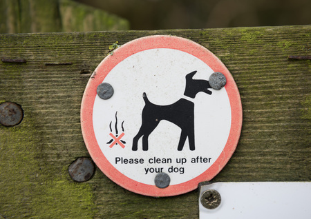 Clean up after your dog sign in the countryside