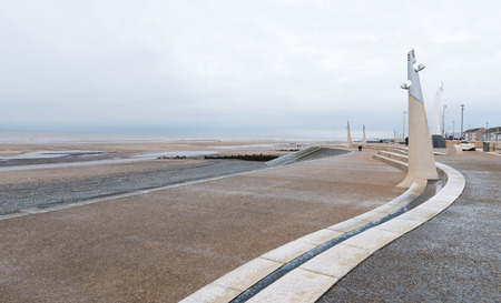 Cleveleys, England, 01/17/2016, Icy cold promenade leading down to a beach on a gloomy winters dayの写真素材