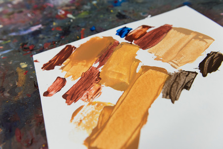 Brown screen print test paint on white cardの写真素材