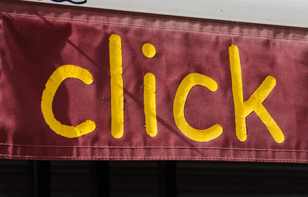 Click sign above an old photography developing shopの写真素材