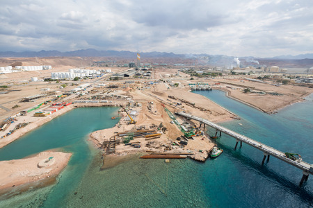 Aqaba, Jordan, 10/10/2015, Metal and concrete Jetty foundation construction at the Aqaba new port photographed from aboveのeditorial素材