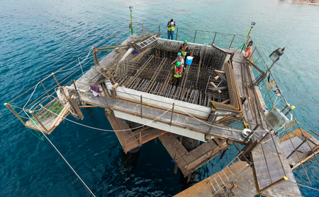 Aqaba, Jordan, 10/10/2015, Metal and concrete foundation construction at the Aqaba new port photographed from aboveのeditorial素材