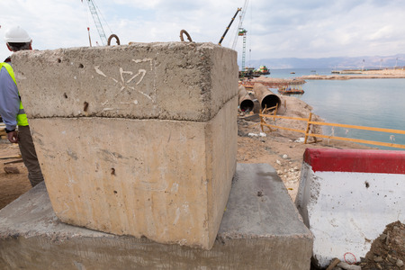 Aqaba, Jordan, 10/10/2015, Concrete building block being used in the foundation construction at the Aqaba new portのeditorial素材