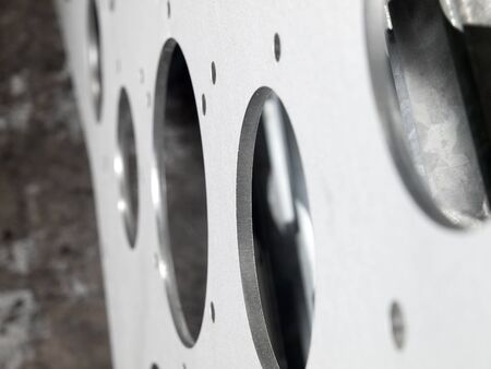 futuristic stainless steel metal, laser cutout on a rustic backgroundの写真素材